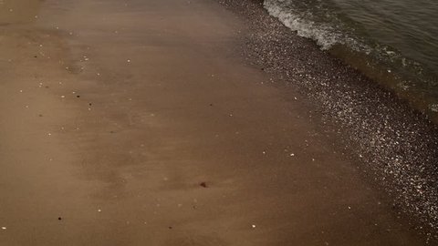 Idyllic scene of waves slowly splashing on the sand. Beautiful beach. Baltic sea.