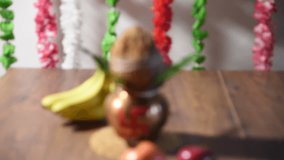 Hindu Puja / Pooja Thali with flowers, copper Kalash with coconut and mango leaves and fruits