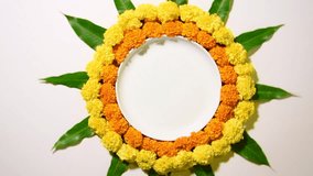 Rotating video showing Marigold Flower Rangoli for Diwali or any other Hindu festival
