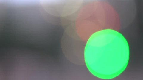 Defocused green circles light effects, abstract blurred motion boche particles