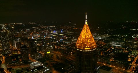 Atlanta Aerial v470 Panning downtown, midtown cityscape night time view with glowing tower in foreground 7/18