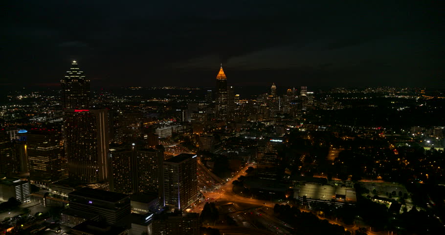 Atlanta Aerial v465 Flying through downtown over freeway with cityscape view at night 7/18