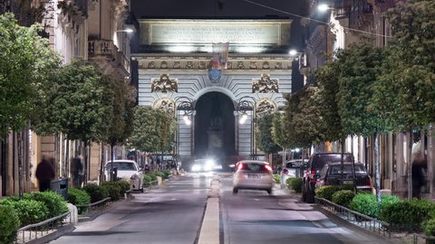 Montpellier, France - May, 2017: Timelapse of the traffic under the Triumphal Arch, in Montpellier, at night.