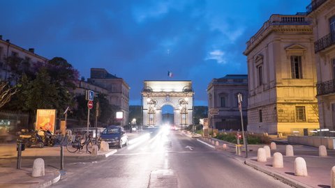 Montpellier, France - May, 2017: Timelapse of the Foch street and Porte Du Peyrou, at dusk.