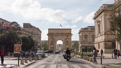 Montpellier, France - May, 2017: Timelapse of the Foch street and Porte Du Peyrou, in Montpellier.