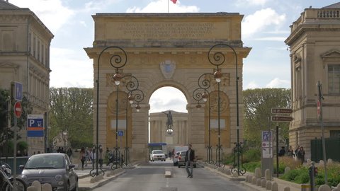 Montpellier, France - April, 2017: Tilt up view of Porte du Peyrou and Rue Foch, in Montpellier.
