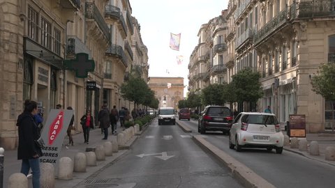 Montpellier, France - April, 2017: Rue Foch with the Arc de Triomphe, Montpellier.