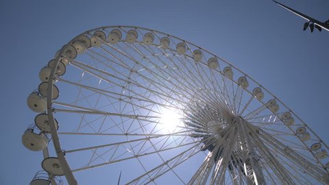 Marseille , France - April, 2017: A spinning Ferris wheel in the sunlight