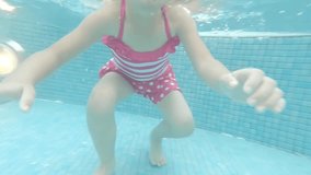 cute girl swim in the swimming pool