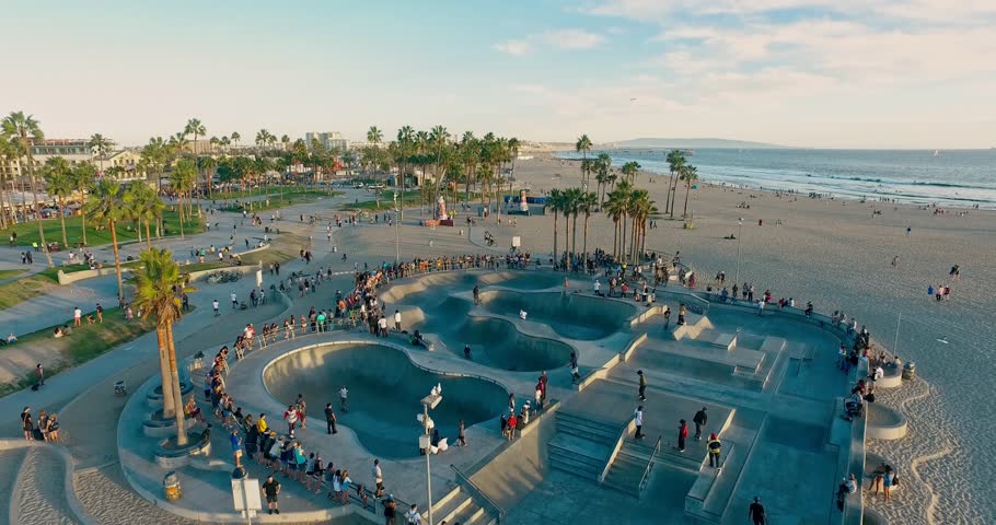 Drone flies under famous skate park in the Venice Beach, Los Angeles on sunset.