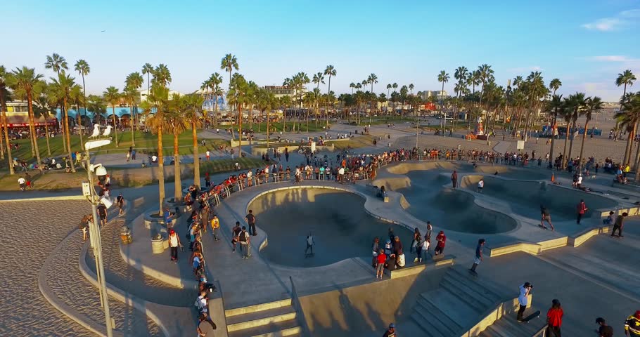 Drone flies under famous skate park in the Venice Beach, Los Angeles on sunset.