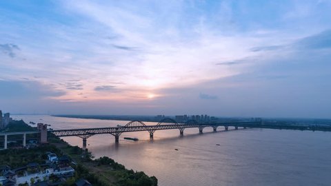 time lapse jiujiang yangtze river bridge in sunset , China