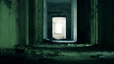 Abandoned long corridor/hallway,dolly slider motion.A long corridor/hallway of a destroyed by an earthquake and evacuated hotel.: film stockowy