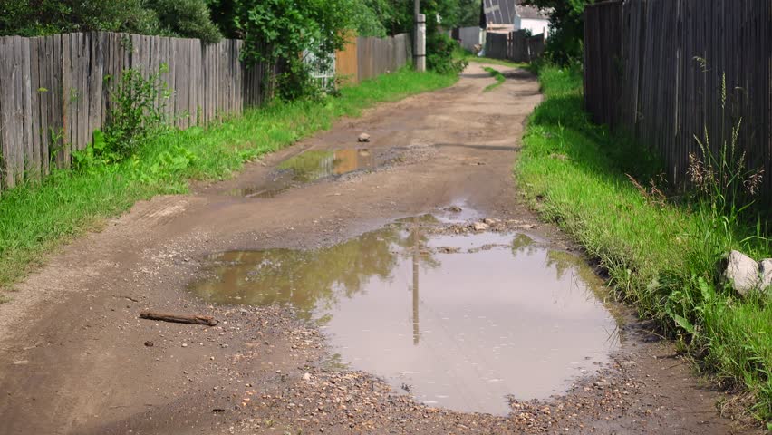 Village. Street. Rural road. Static camera.