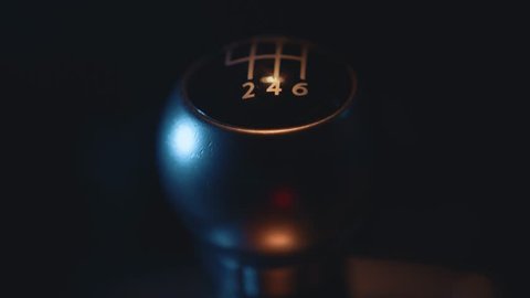 Car Interior - Shifting / Changing Gear Stick in Manual Car, Close Up, Night Time with Street Lights