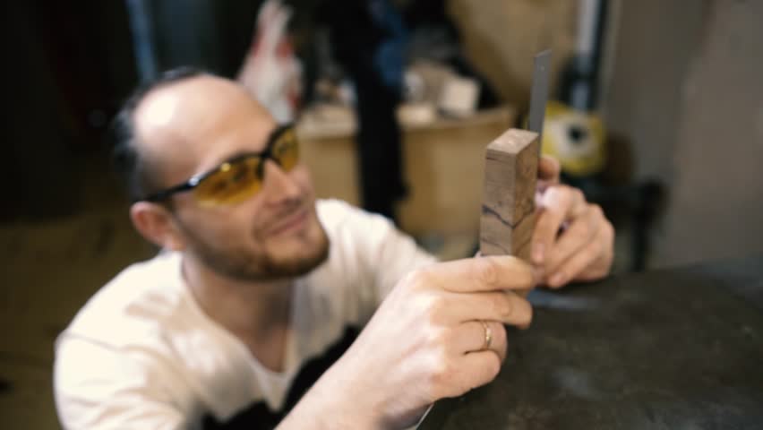 Industrial carpenter worker operating wood