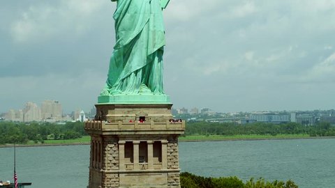 Aerial rising footage of the Statue of Liberty