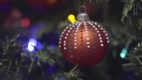 Christmas and New Year Decoration in dots. Abstract Blurred Bokeh Holiday Background. Blinking Garland. Christmas Tree Lights Twinkling.
