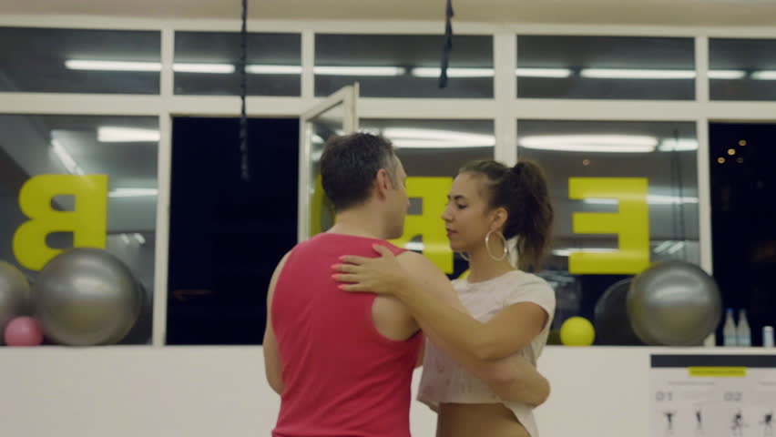 Man and woman dacing bachata. Close up portrait shot. Slow motion footage