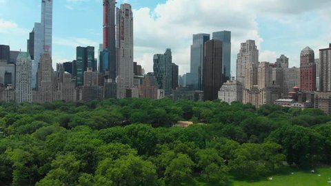 Downtown. Top view of central park in New York city with tall skyscrapers