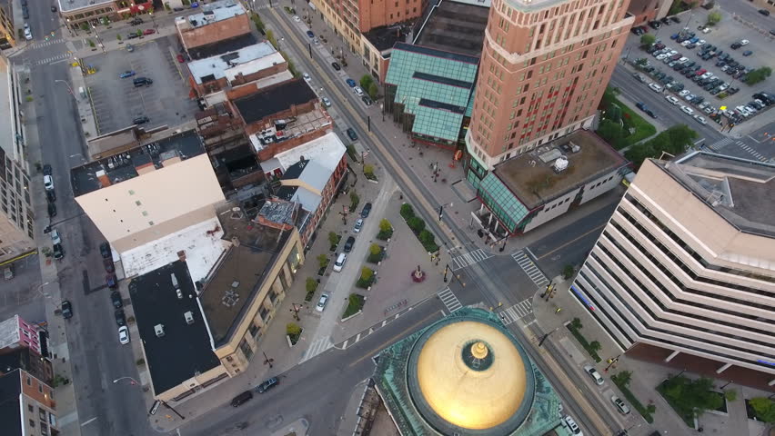 Aerial of Downtown Buffalo New York at Sunrise. Flying over the city of Buffalo NY in first light of the morning. Urban city scene.