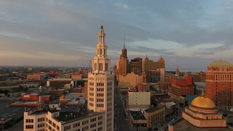 Aerial of Downtown Buffalo New York at Sunrise. Flying at sunrise in Buffalo NY. Urban city establishing shot with tall buildings. Dramatic city scene from above.