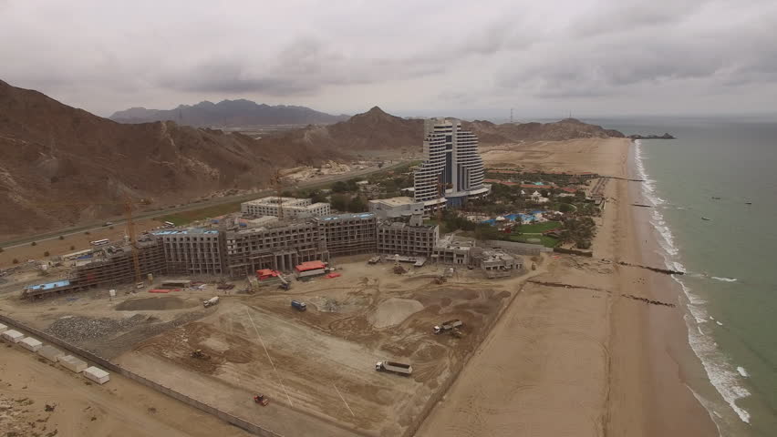 Aerial view of Construction Resort Hotel in Fujairah beach coast line 4k video