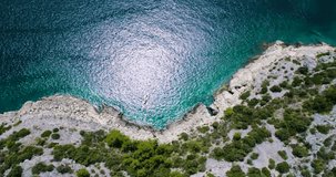 Beautiful 4K aerial video of Dalmatia, Croatia, Europe. Nice nature and landscape on warm sunny summer day at Adriatic Sea and coast. Lovely seascape and outdoors shoot with drone from above in sky.