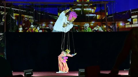 MANDALAY, MYANMAR - DECEMBER15, 2017 : Myanmar men puppeteer playing their puppets at Mandalay, Myanmar in Dec. 15, 2014.
