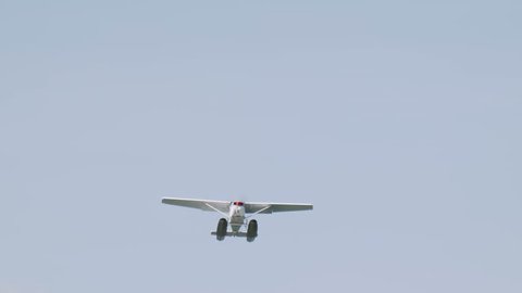 Close up of floatplane flying in blue sky