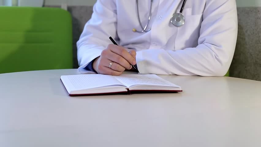 Doctor Writes a Prescription Royalty-Free Stock Footage #1014806108
