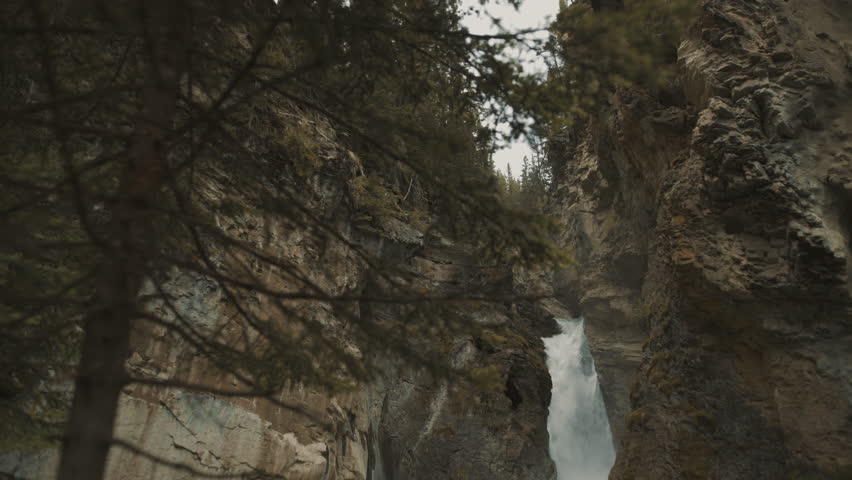 4K Lower waterfalls in Johnston Canyon, Banff, Alberta, Canada - wide angle, daytime