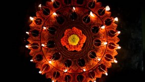 Diwali diya or oil lamp with flowers, gifts etc - Powered by Shutterstock - Get 15% off with code: PIKWIZARD15