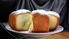 Buchty - Czech traditional sweet dessert sprinkled with powder sugar usually filled with poppy seeds, special jam (called povidla) or quark.