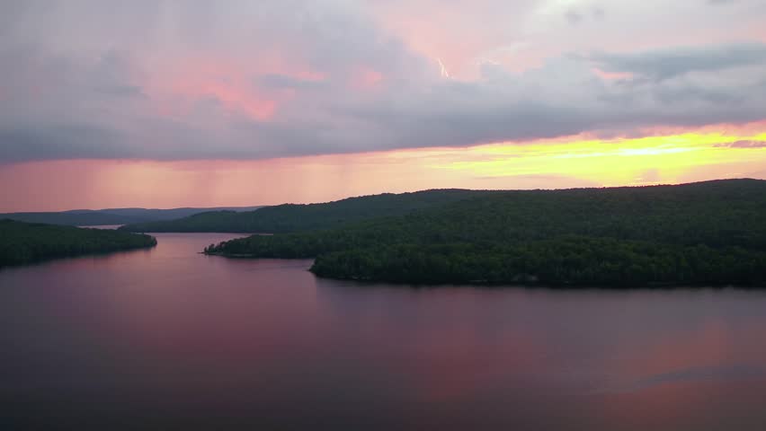 Colorful sunset over lake aerial