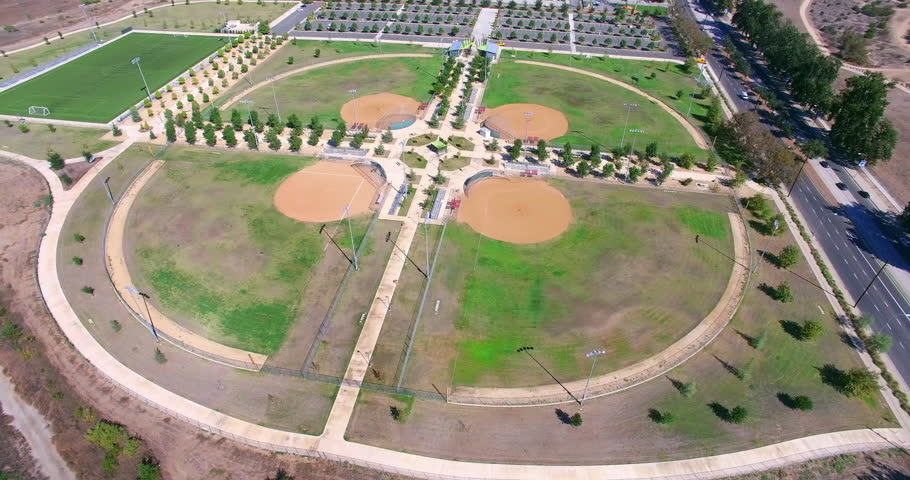 Aerial  view of baseball stadium field and a baseball diamond with green grass in Los Angeles, California, 4K
