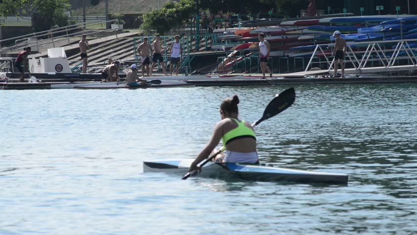 training with canoes in the lake in anticipation of a race