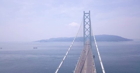 
Akashi Kaikyo, The Longest Suspension bridge in Japan. It is 4k video from Drone eye view, Aerial view or Top view. There are many cars and truck transport by this bridge