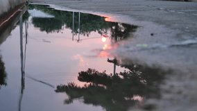 reflection twilight sunset sky in puddle water flooding on street - Powered by Shutterstock - Get 15% off with code: PIKWIZARD15
