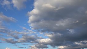 This stock video shows Slow Motion Beautiful Background Cinematic Clouds in mysterious blue sky. The sky looks completely mystical, offering a nice abstract that can be added to many video projects.