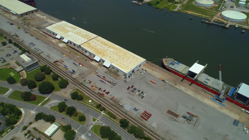 Aerial tilt up reveal port Mobile Alabama industrial site