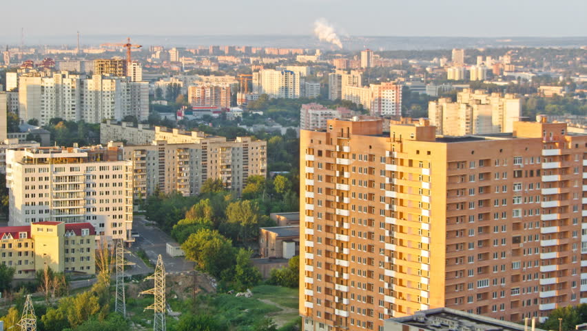 Kharkiv city from above timelapse at morning with moving shadows. Aerial view of the city center and residential districts. Ukraine.