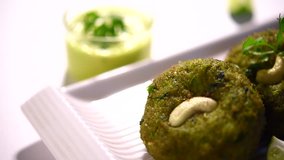 footage of Hara bhara Kabab or Kebab which is an Indian vegetarian snack recipe made using spinach, potatoes and green peas and spices, selective focus
