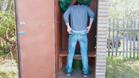 Man Pees Outside Toilet Pot Village Stock Footage Video (100% Royalty