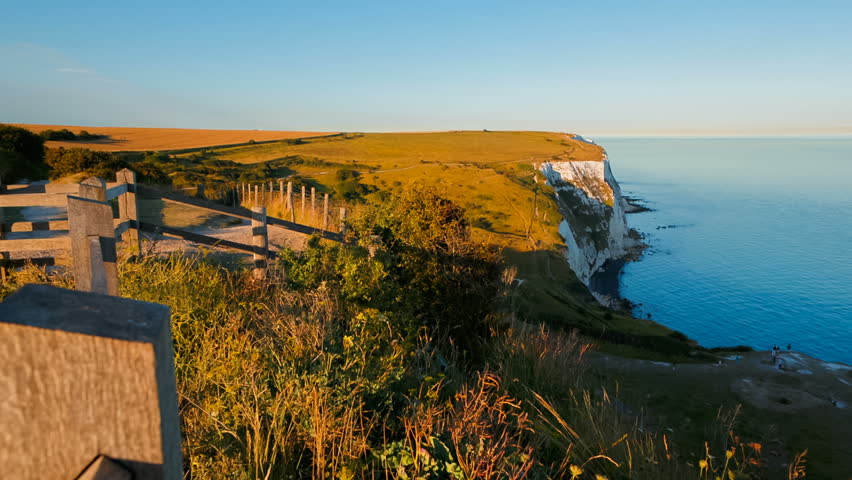Establishing shot of the beautiful White Cliffs of Dover, in Kent, England, a designated Area of Outstanding Natural Beauty owing to its chalk composition accented by streaks of black flint