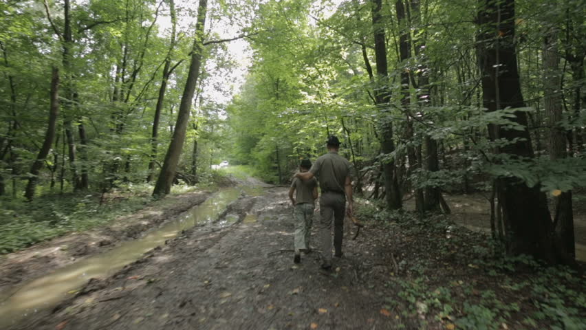Hunter and his son walk into the forest