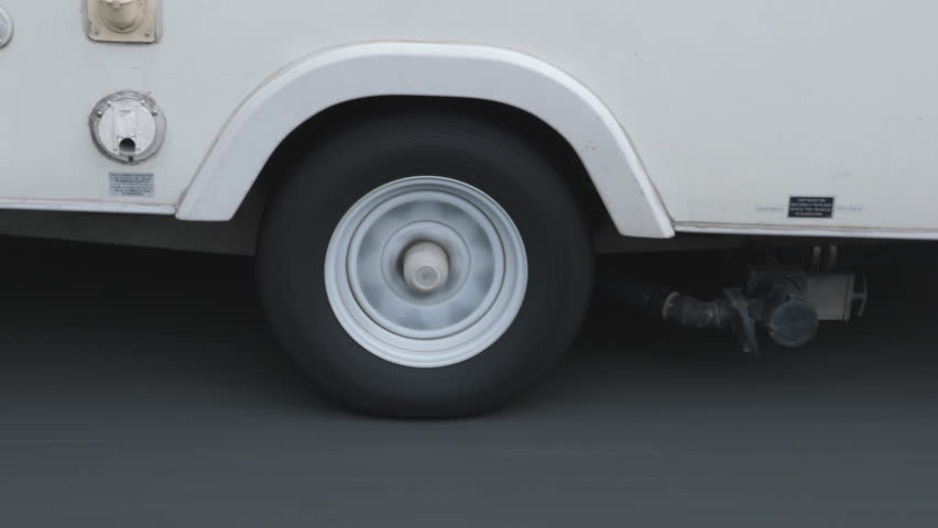 Passing camper caravan being pulled by SUV. Detail of wheel and outlets. Royalty-Free Stock Footage #1014906382