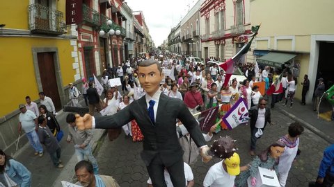 Puebla City, Puebla. Mexico. August 12, 2018. More than 8000 people asking to cancel the state elections for alleged electoral fraud. Pinata of the former Governor Rafael Moreno Valle