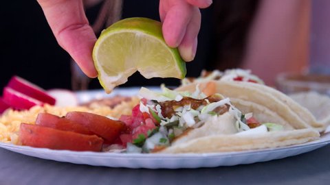 Super Slow Motion Lime Squeeze and Juice Dripping on Tacos
