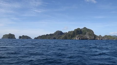 Beautiful Landscape in Philippines. Sea with Rocks and Mountain in Background. Clear Blue Sky and Sunny Day. Close to El Nido, Coron. 